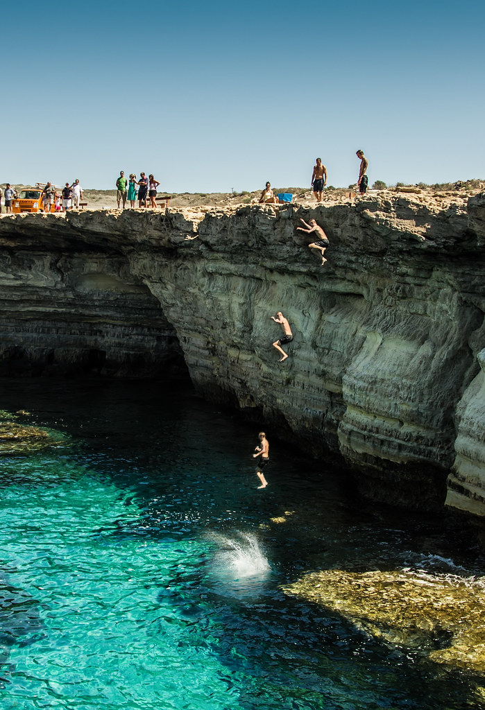 Cliff Jump Some guy jumping off a cliff into the sea at Ay… Flickr