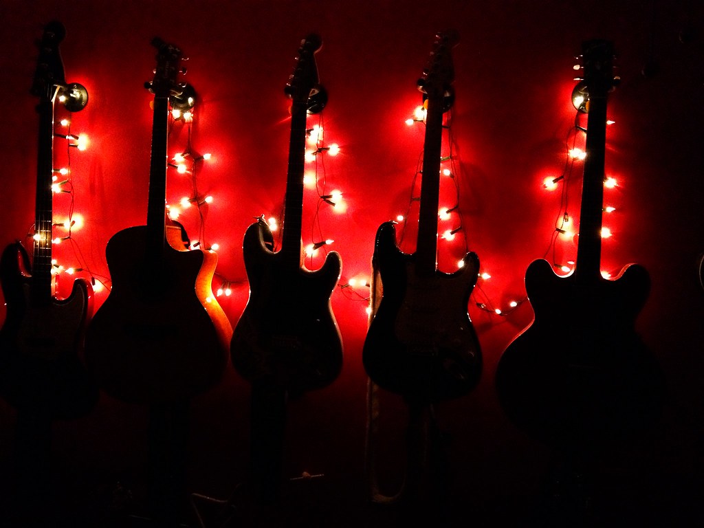 Christmas Guitars My annual festive guitar wall. Goyey Flickr