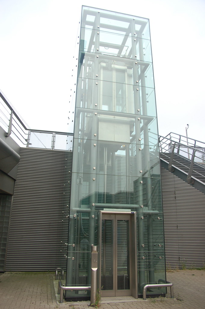A glass elevator just outside the musical underpass Jason