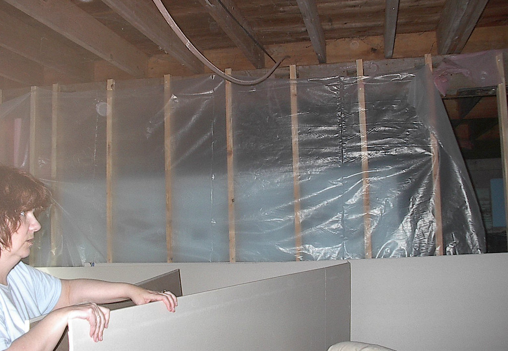 Adding plastic, starting drywall Owain and Ceredwyn put up… Flickr