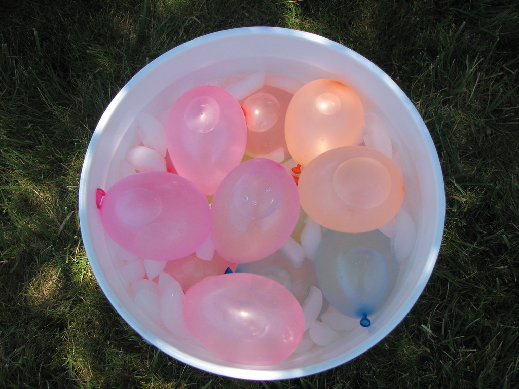Bucket of water balloons in ice water Ready for throwing. … Flickr