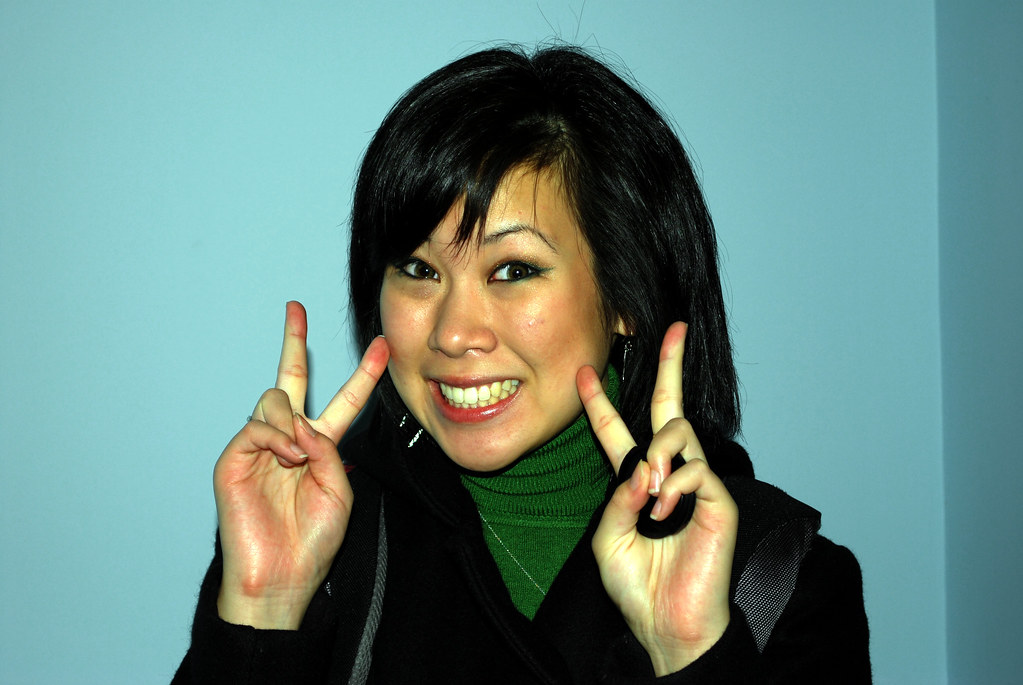Why Do Asians Love To Hold Up The 'Peace' Sign In Photos?