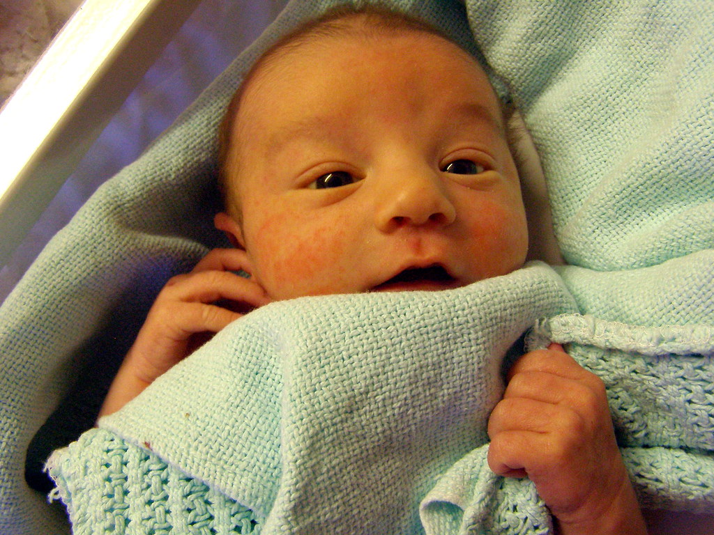 Finn 3 Playing with a hospital baby blanket in his waterbe… Flickr
