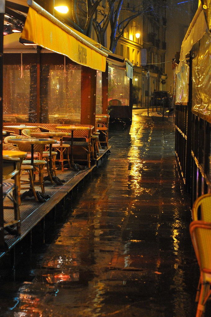 Empty terrasses in Paris under cold rains Seen in the