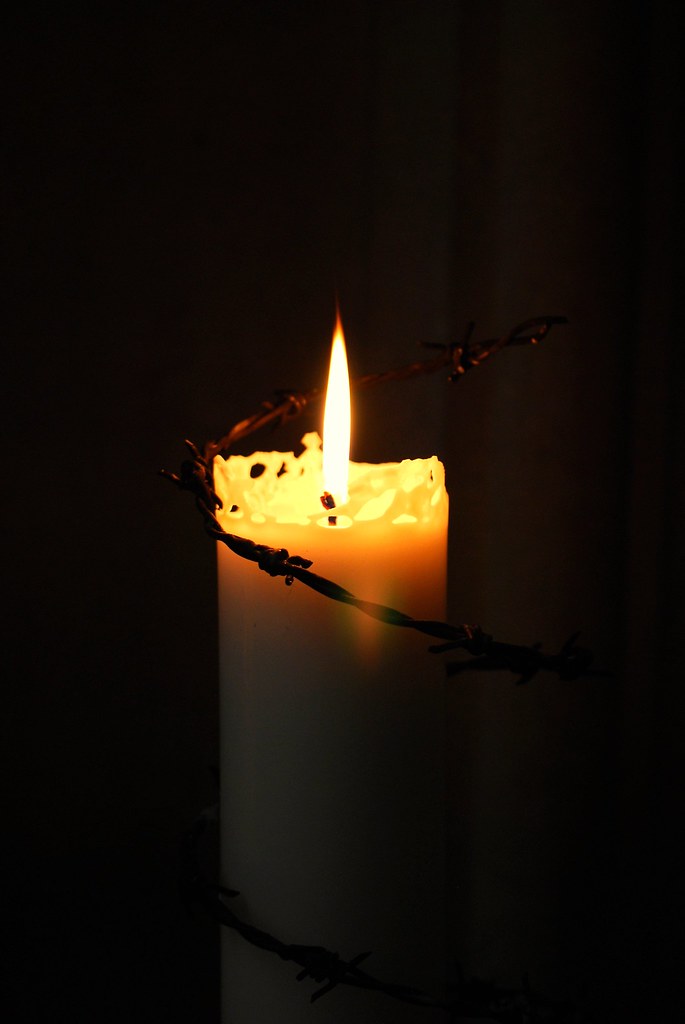 Amnesty International Candle wrapped with barbed wire, lik… Flickr