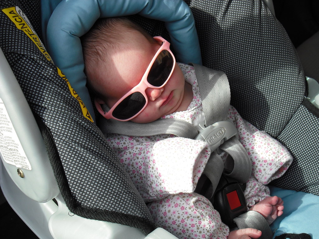 In car seat with sunglasses Our daughter in the car, ready… Flickr