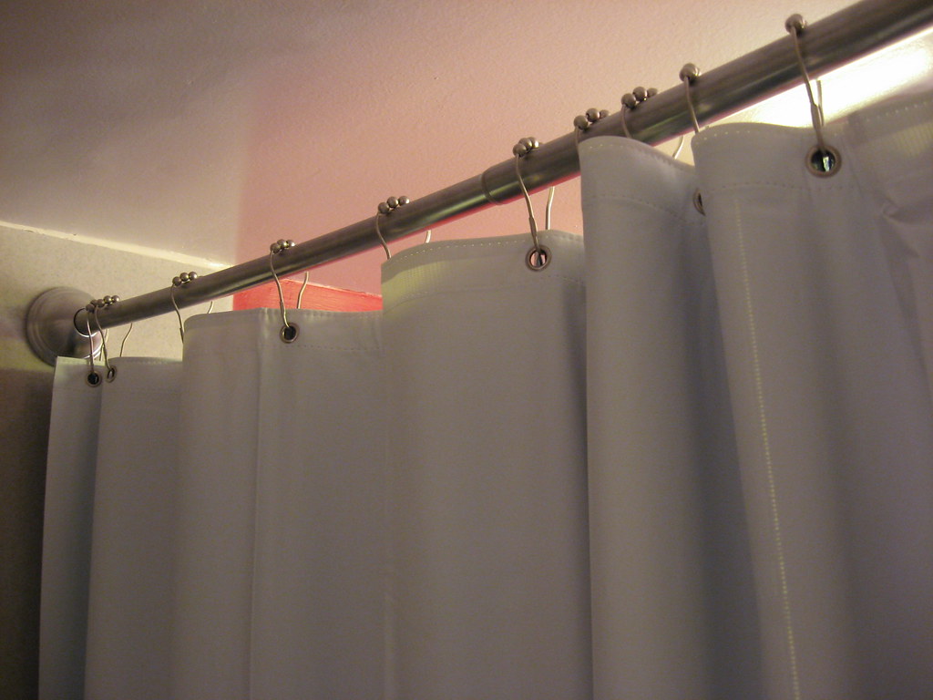 Curved shower curtain bar with ball bearing hooks This bar… Flickr