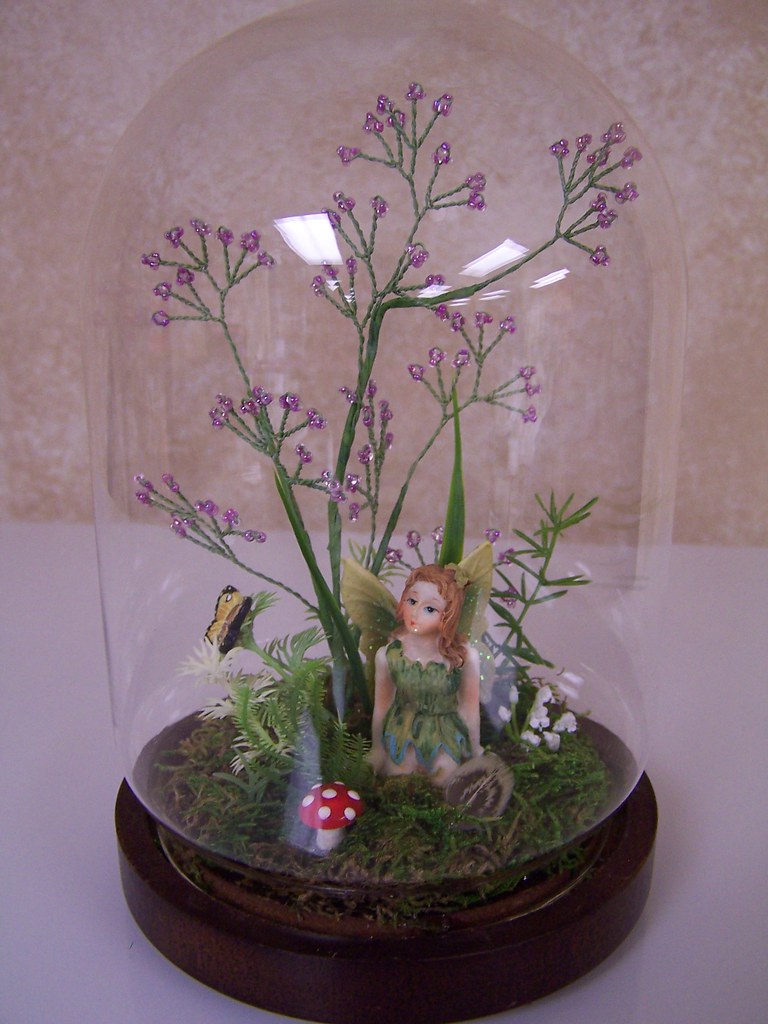 Captured Fairy This glass dome had a gaudy Christmas arran… Flickr