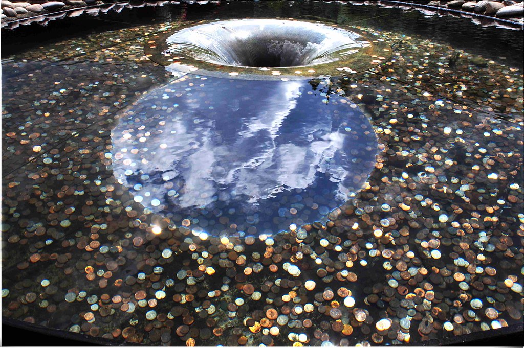 Coins in a fountain I was walking into a retail outlet whe… Flickr
