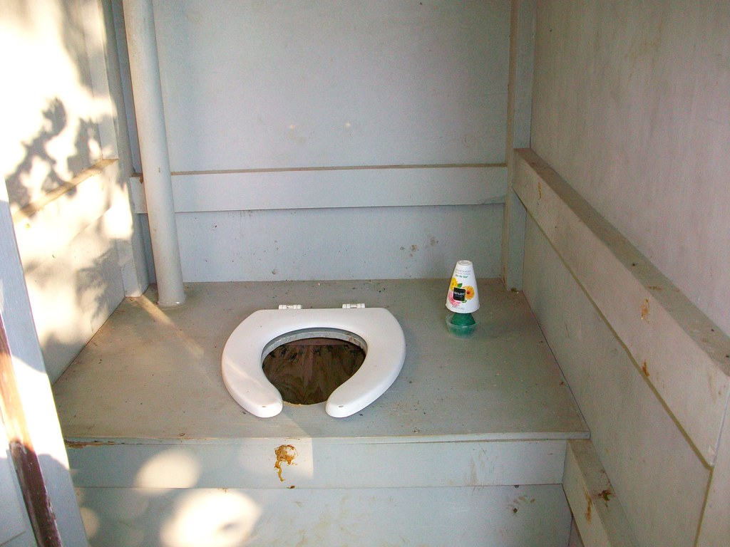 Outhouse Interior A pit toilet or outhouse. These are comm… Flickr