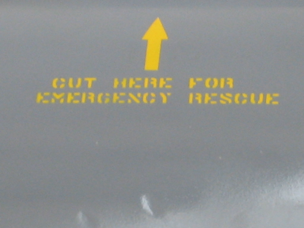 Cut here for emergency rescue Sign on the side of an aircr… Flickr
