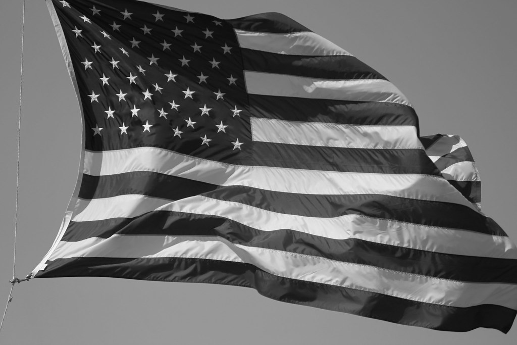 The Flag High flying black and white US flag during the Me… Flickr