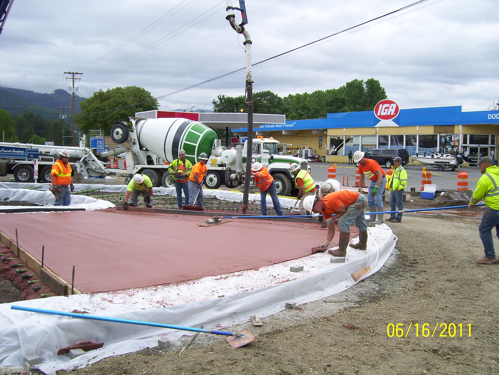 Pouring the red concrete for the roundabout truck apron Flickr