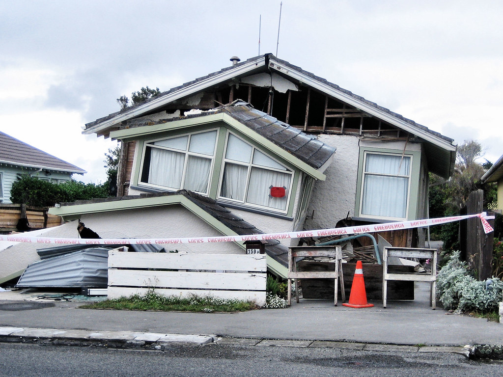 Damaged house following Feb 22 quake A badly damaged house… Flickr