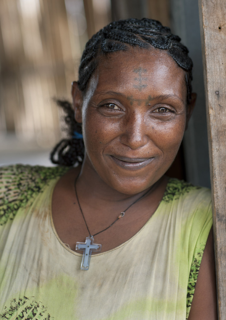 Tattooed Forehead Woman With A Christian Cross Pendant Eth