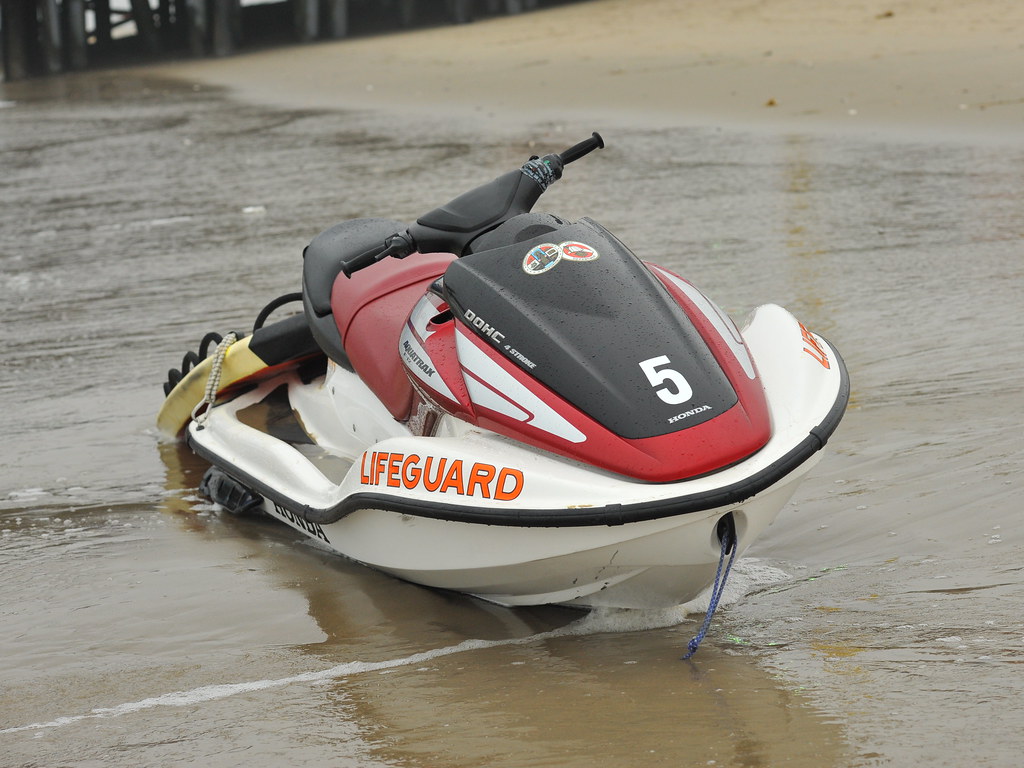 Lifeguard Jet Ski A jet ski is anchored in the sand as lif… Flickr
