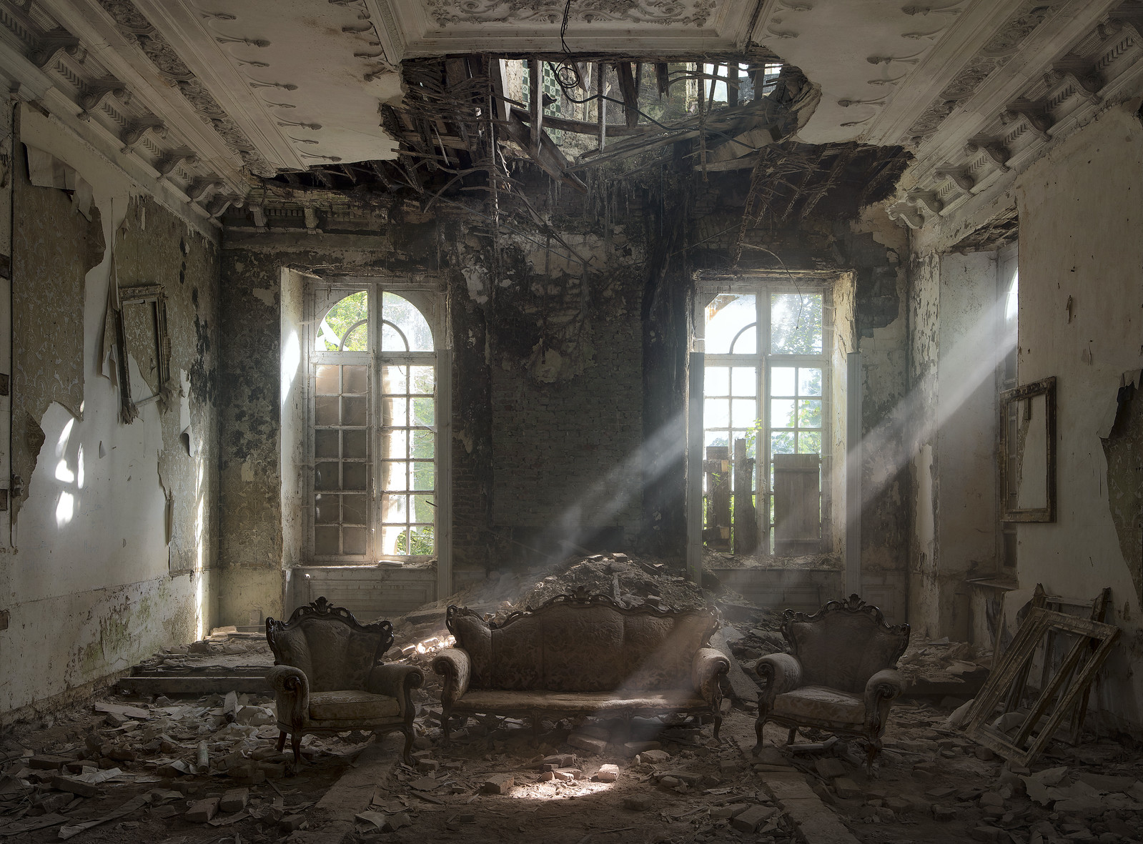 Light beams pick out dust suspended in the air at a chateau in Belgium