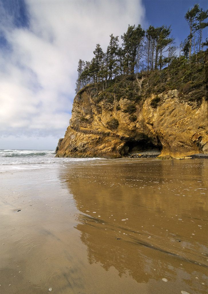 Arch Cape There is a waterfall that spills right onto the … Flickr