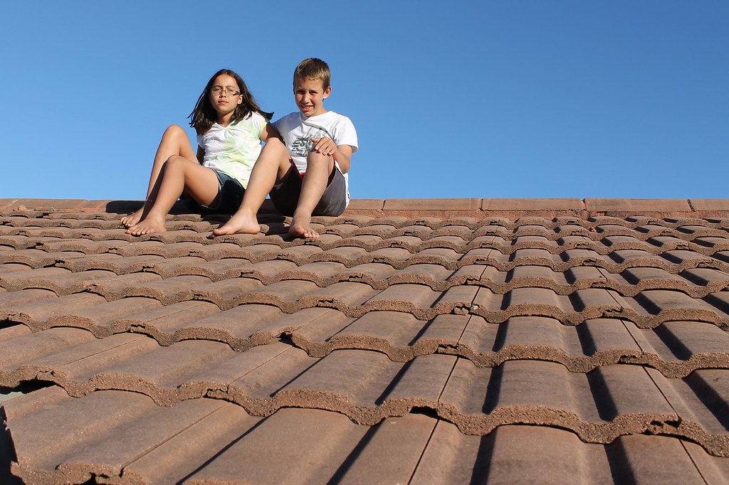 Sitting on the roof My children sitting on the roof. Why? … Flickr