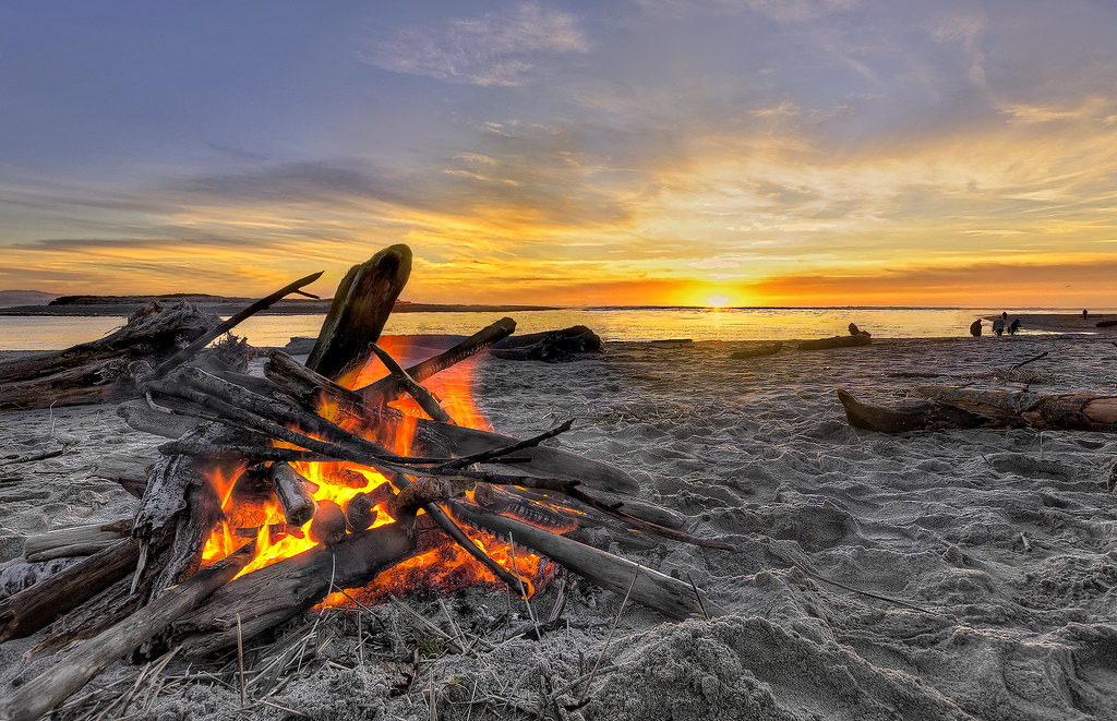 There's nothing better than a beach fire at sunset. Flickr