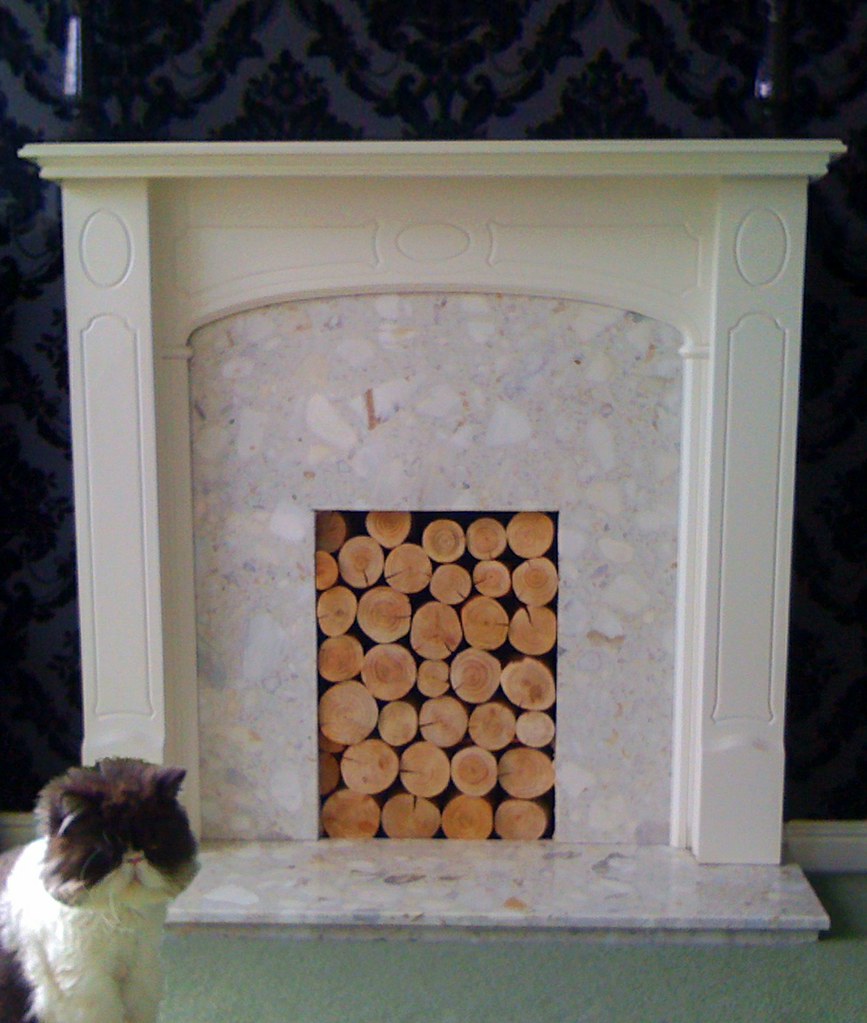 Decorative logs in feature fireplace A neat use of our logâ€¦ Flickr