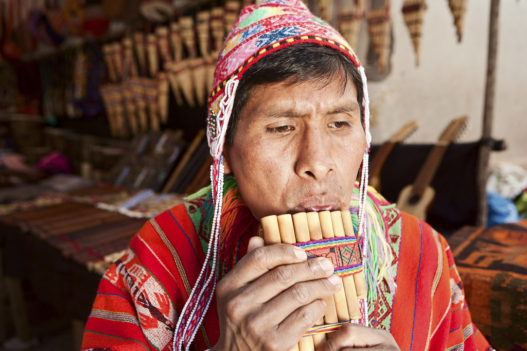 Portrait of Peruvian man playing a siku (panpipe), Pisac m… Flickr