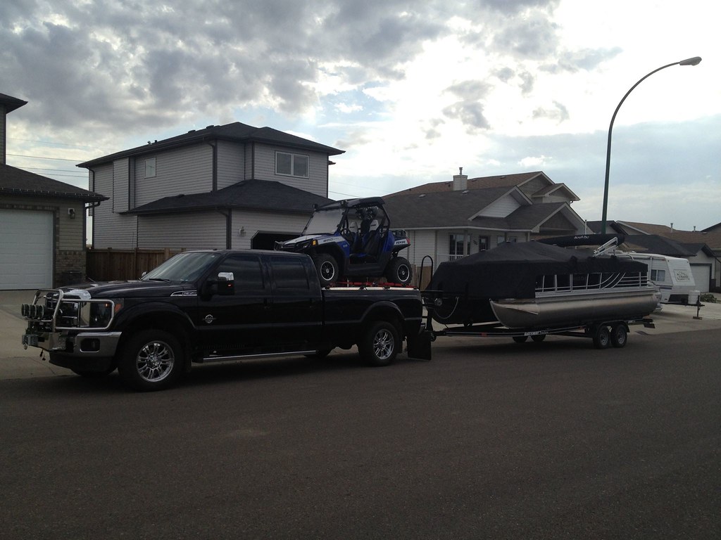 Pickup Truck Towing Boat Trailer and Hauling Side by Side … Flickr