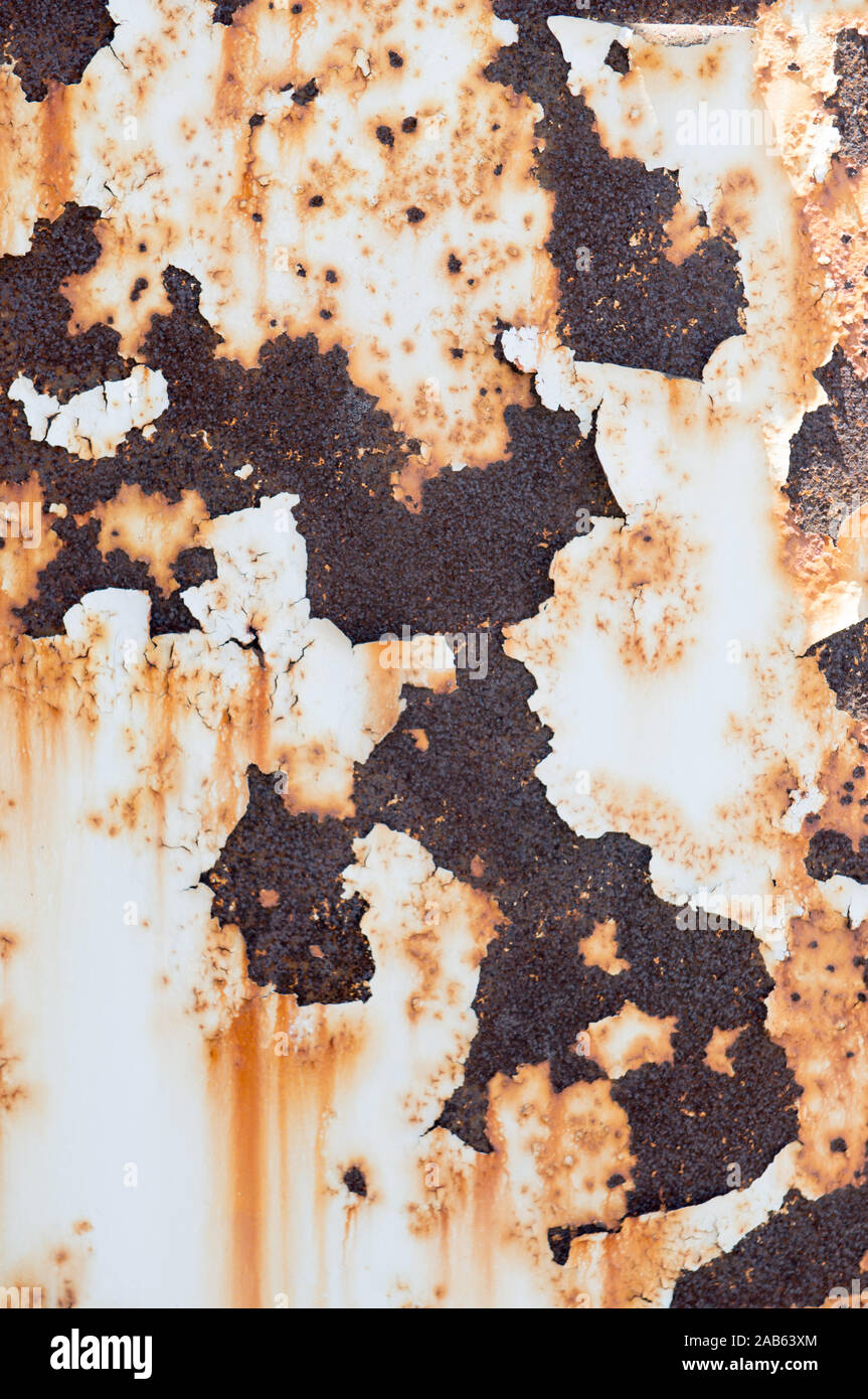 Rust seeping through flaking paint on metal post Stock Photo Alamy