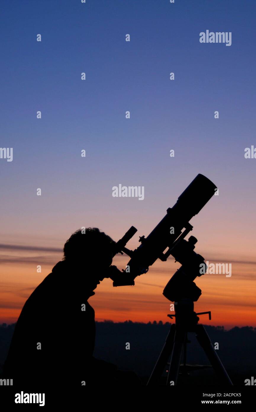 Astronomer using a telescope Stock Photo Alamy