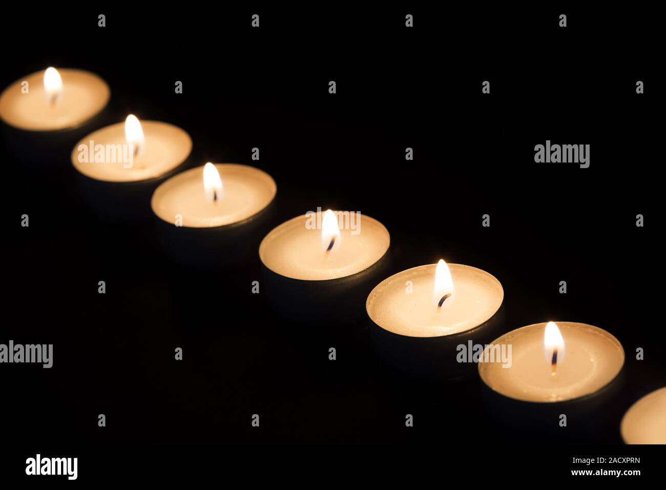 Burning tea lights Stock Photo Alamy