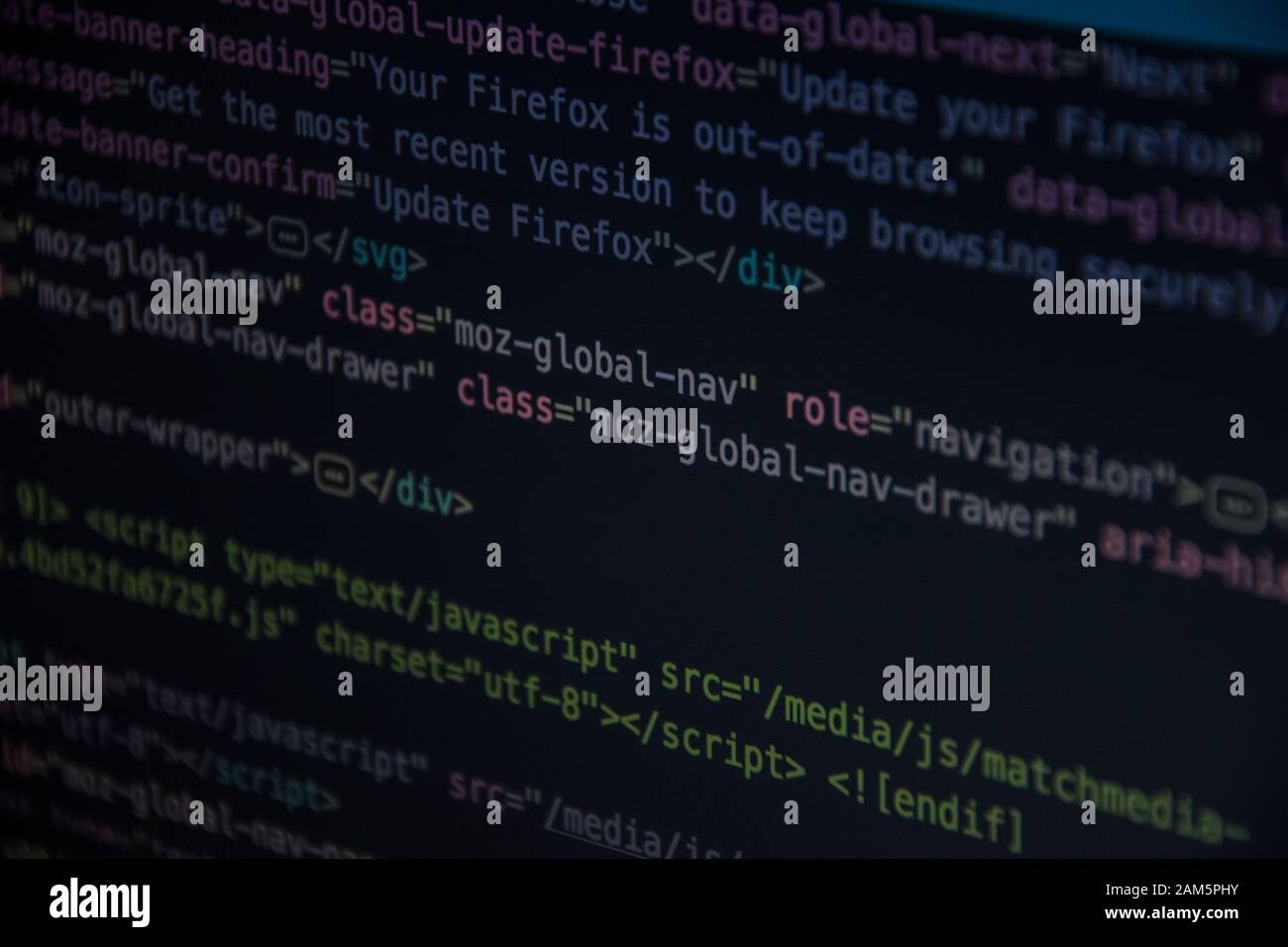 Close up css HTML code on monitor screen with black background Stock