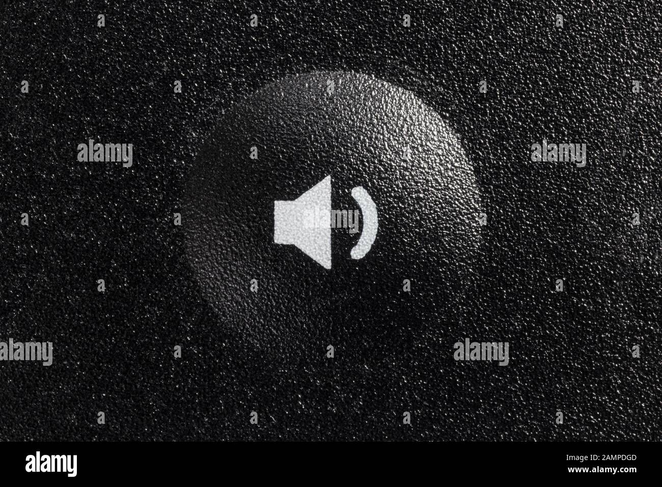 Low volume button on remote controller closeup macro photograph Stock