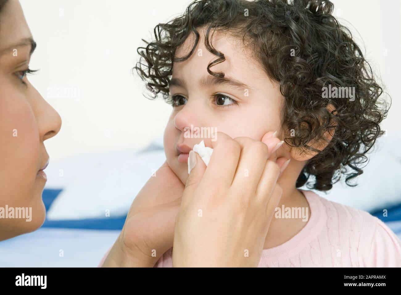 Child wiping tears of mother hires stock photography and images Alamy