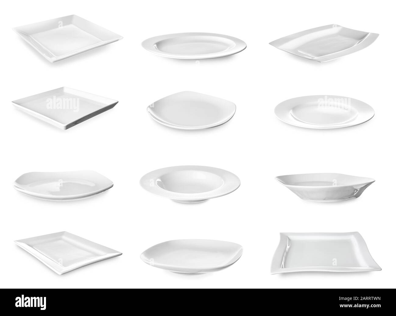 Different ceramic plates on white background Stock Photo Alamy