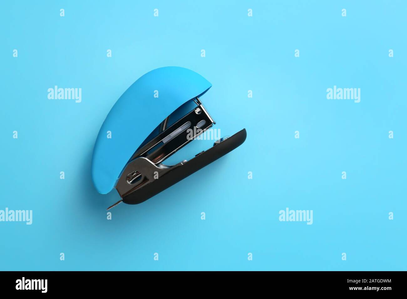 Office stapler on color background Stock Photo Alamy