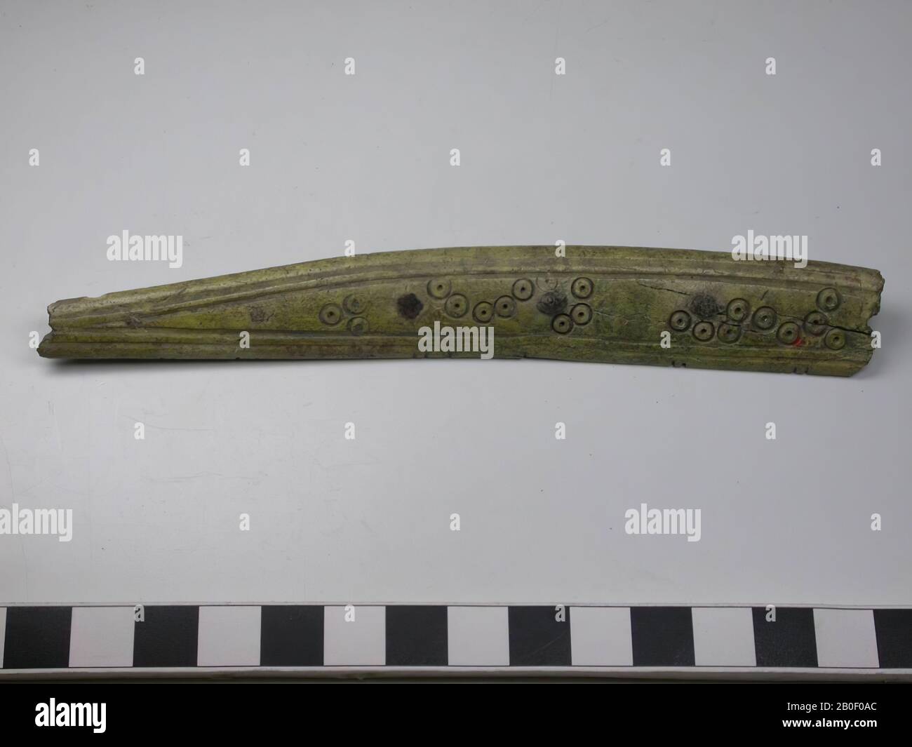 Fragment Of A Handle Blade Of A One Sided Three Layer Comb Type