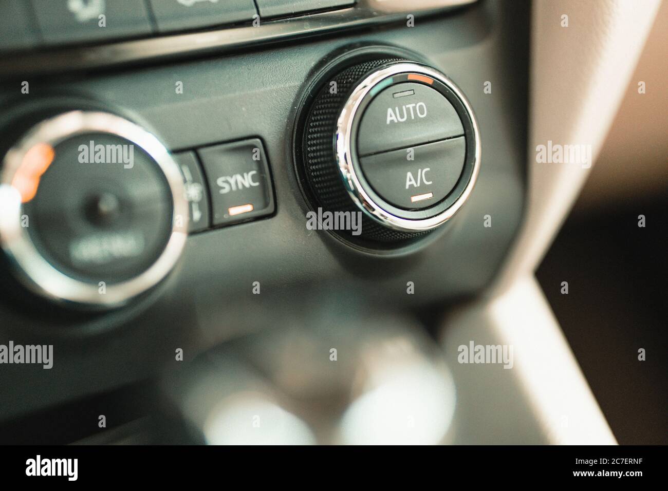 closeup car air conditioner ventilation system control knobs Stock