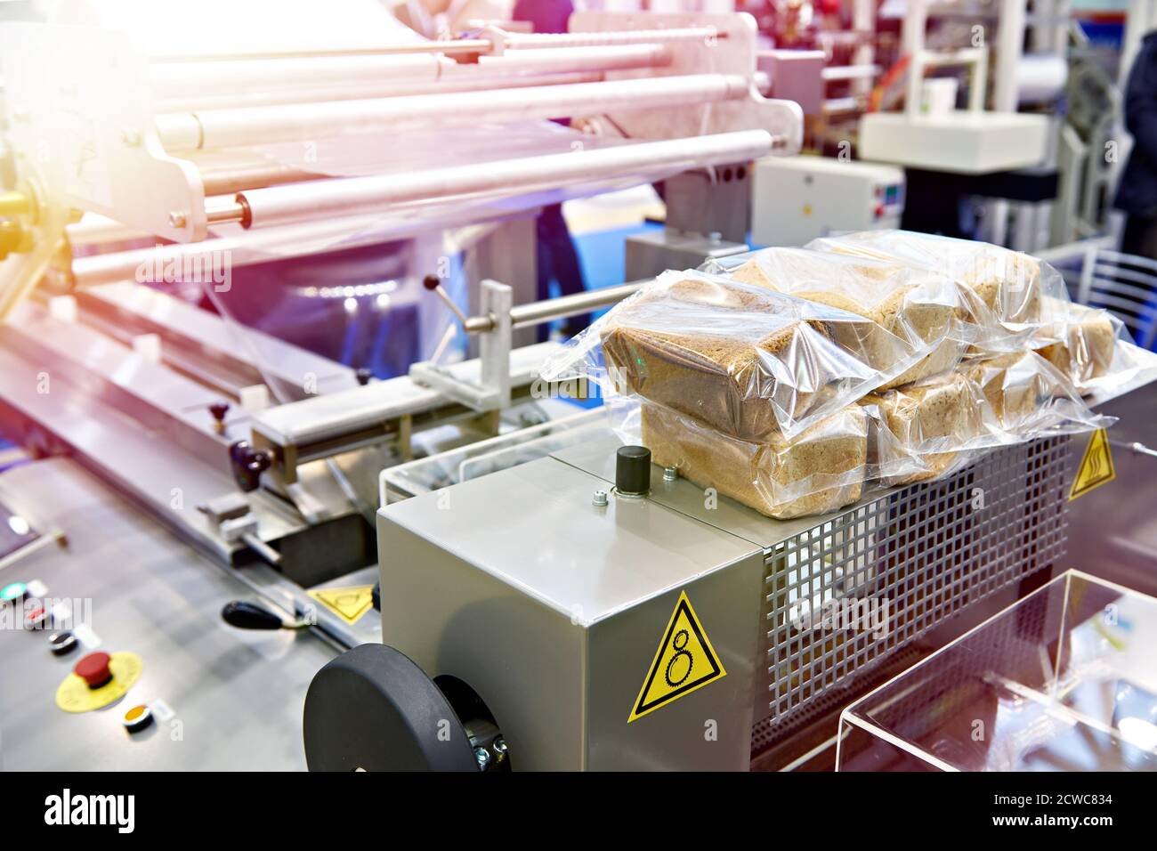 Bread packaging machine at food factory Stock Photo Alamy