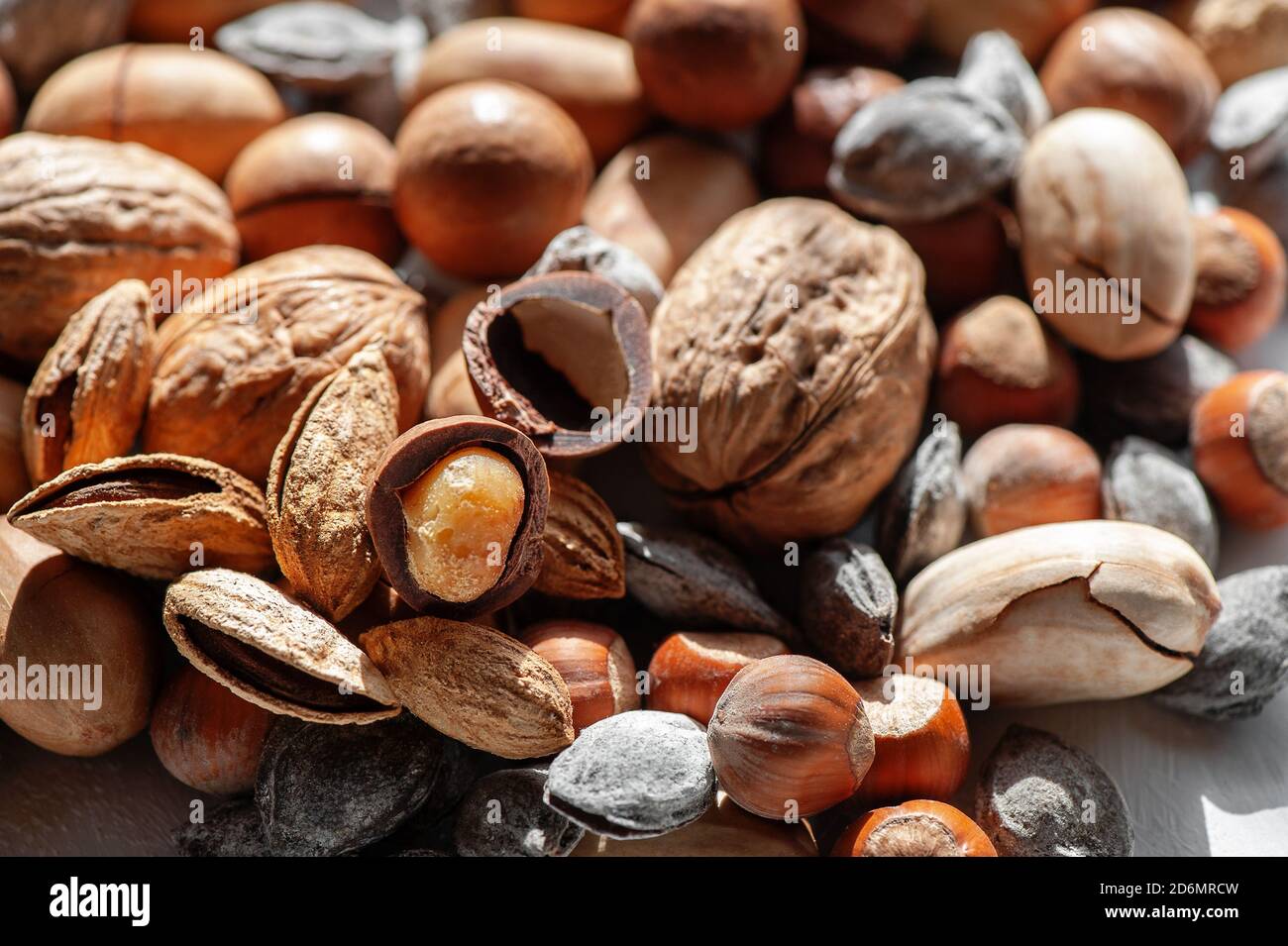 assorted nuts. Different types of macadamia nuts, walnuts and hazelnuts