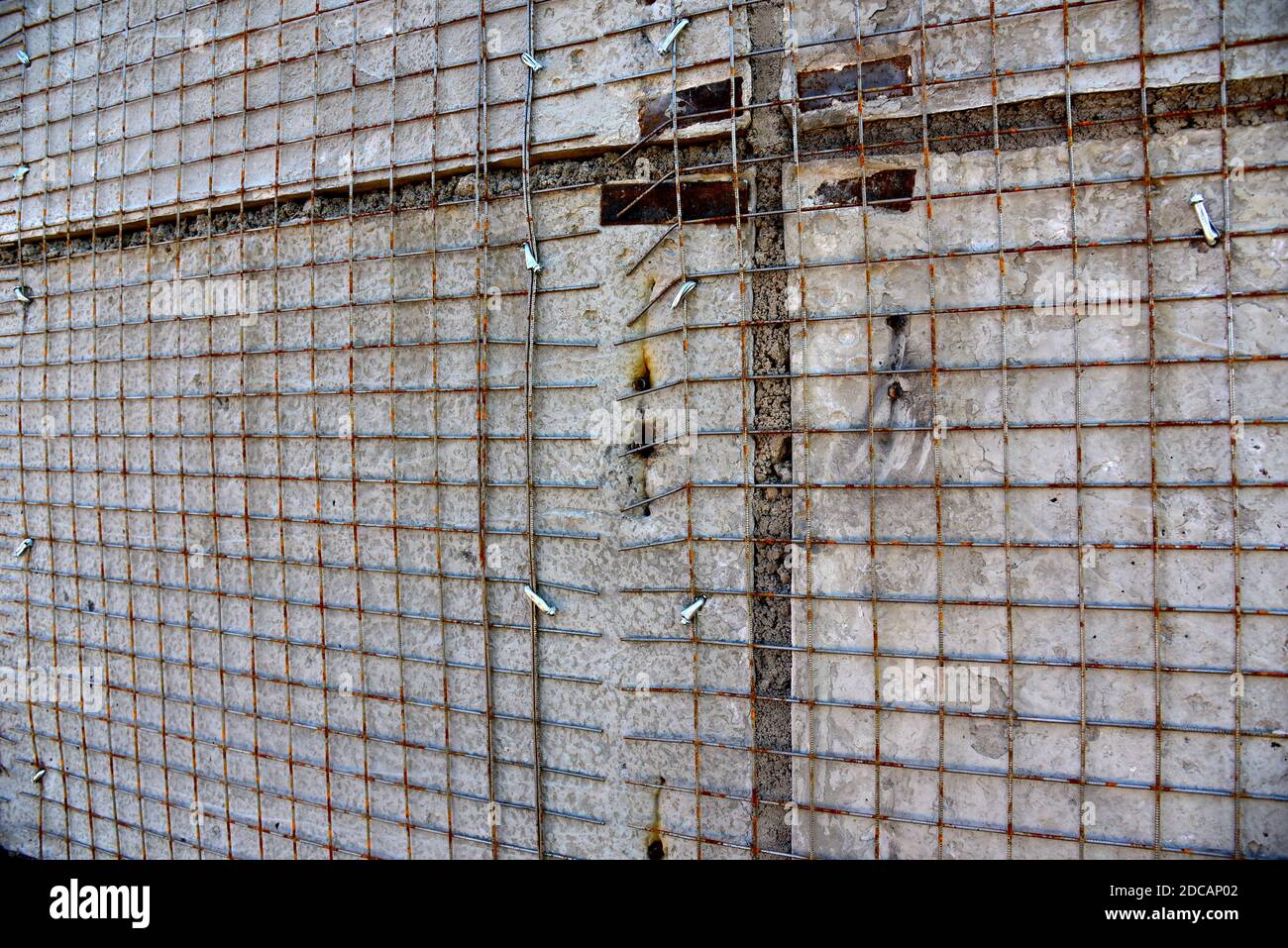 Strengthening of concrete block masonry walls using steel wire mesh