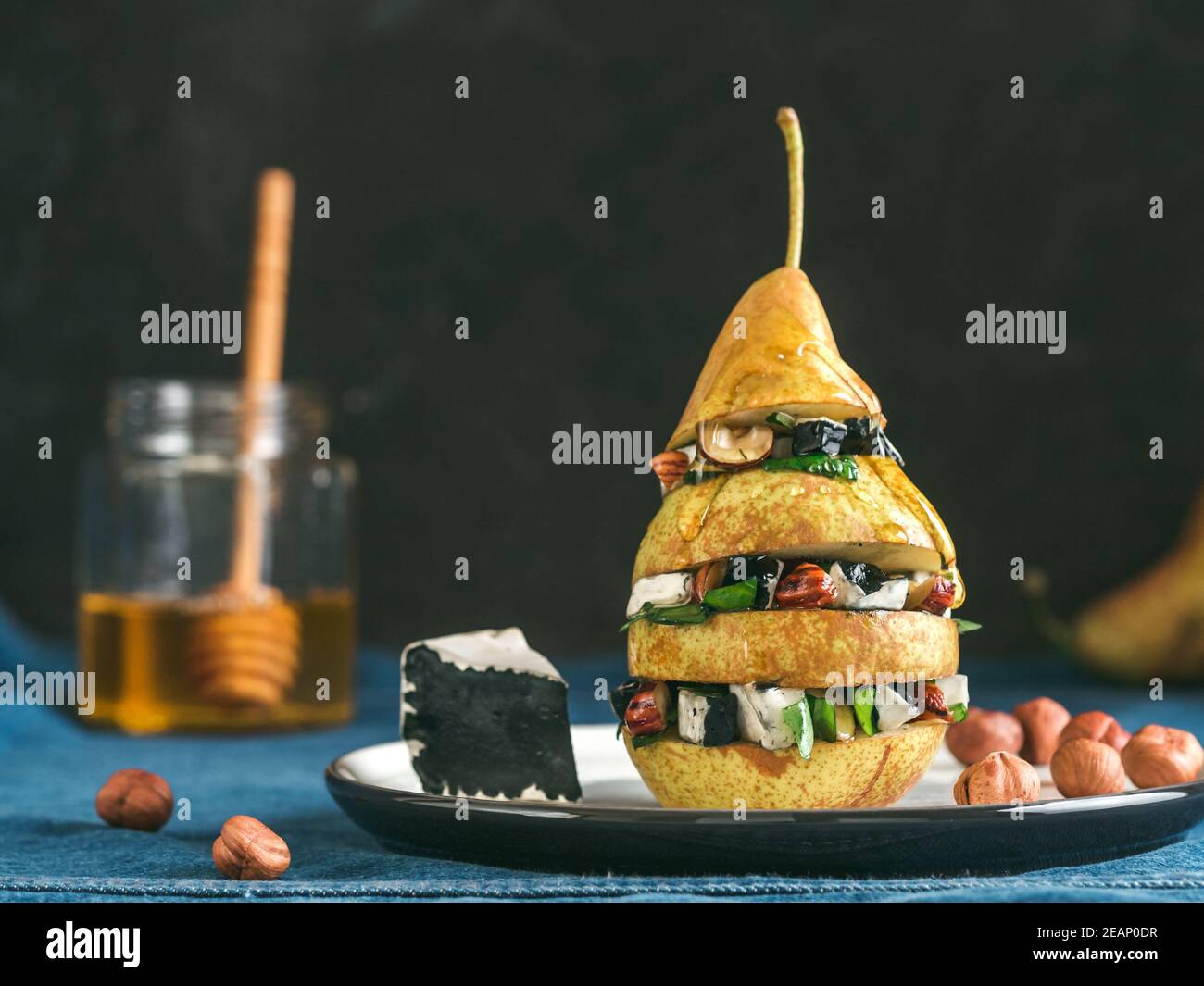 Pear and cheese salad with basil, nuts, honey Stock Photo Alamy