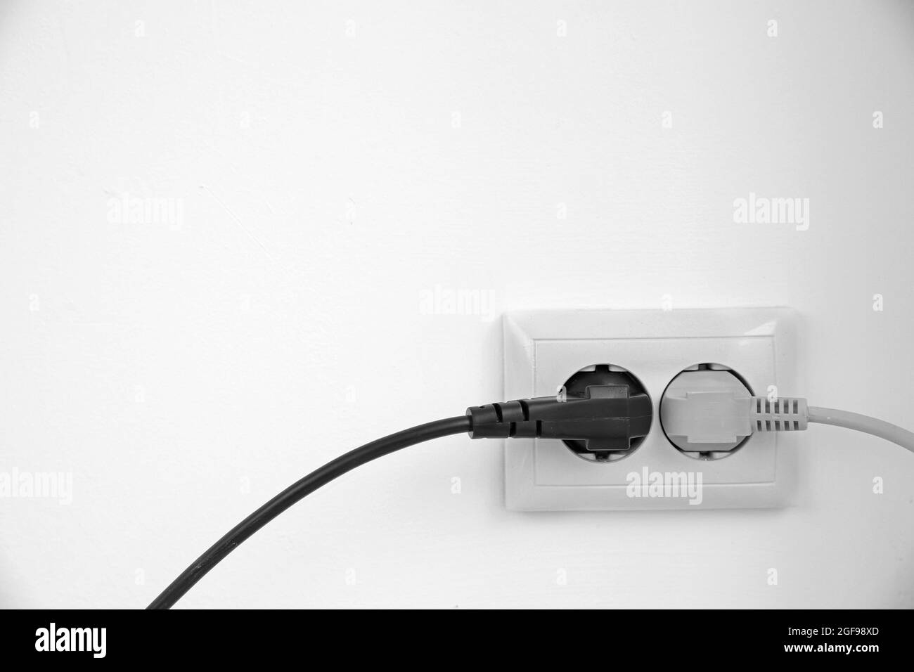 Electric plug in socket Stock Photo Alamy