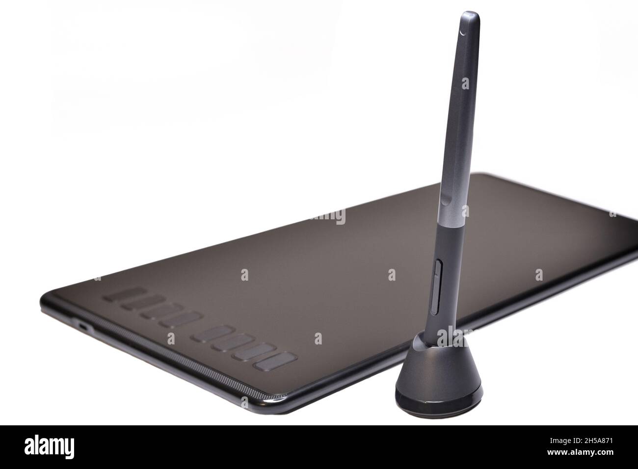 Digital pen and graphics tablet on white background. Stylus and digital
