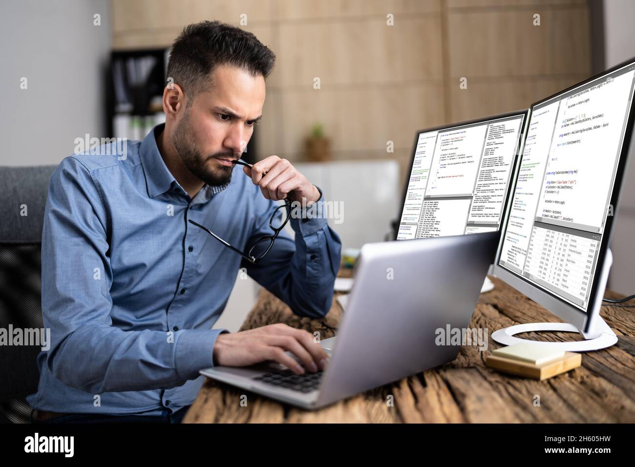 Coder Using Computer At Desk.  Developer Stock Photo Alamy