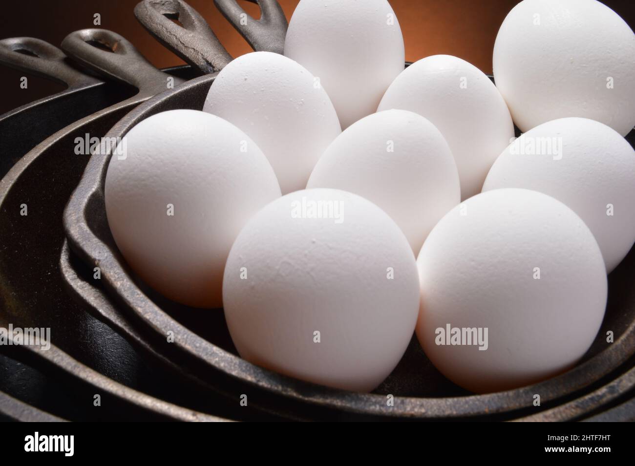 Eggs in cast iron skillets Stock Photo Alamy