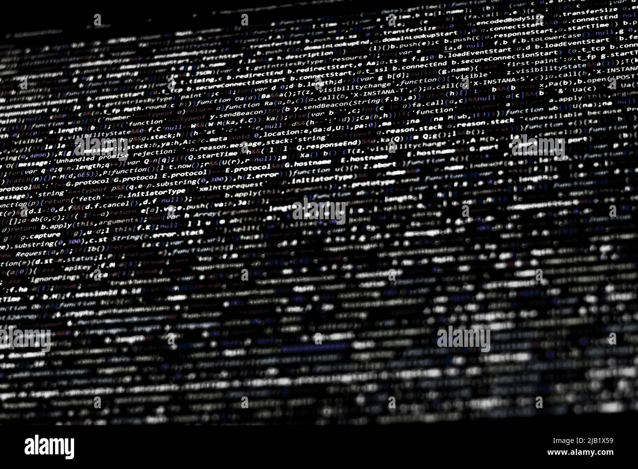 Black and white code background. javascript code on computer screen