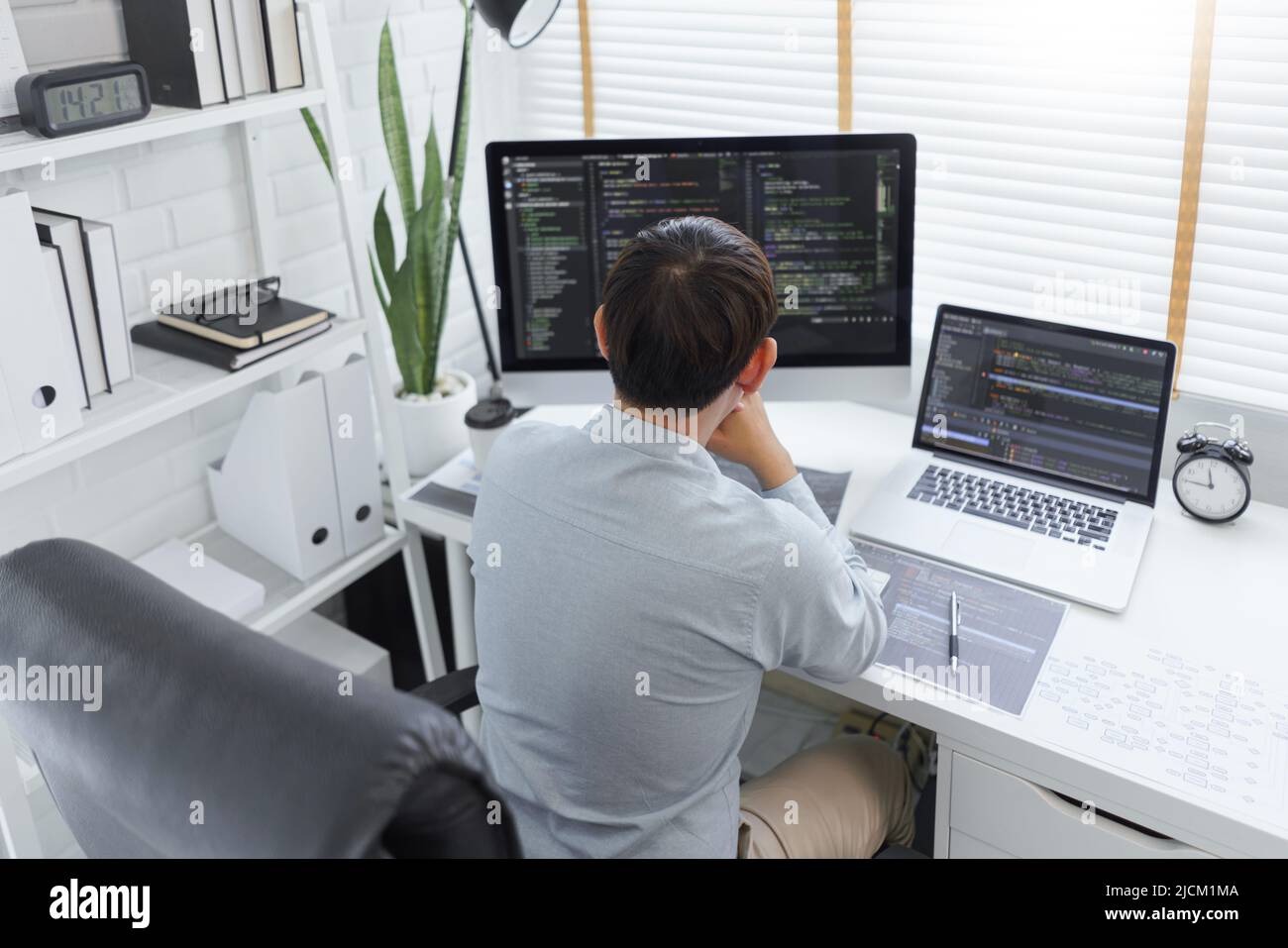 Software development concept, Male programmer typing data code and