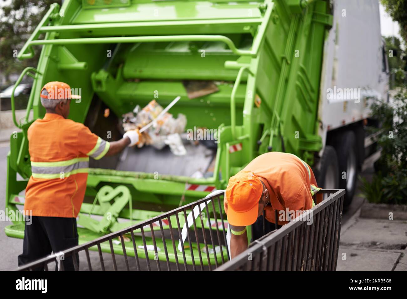 Garbage collection day. a garbage collection team at work Stock Photo