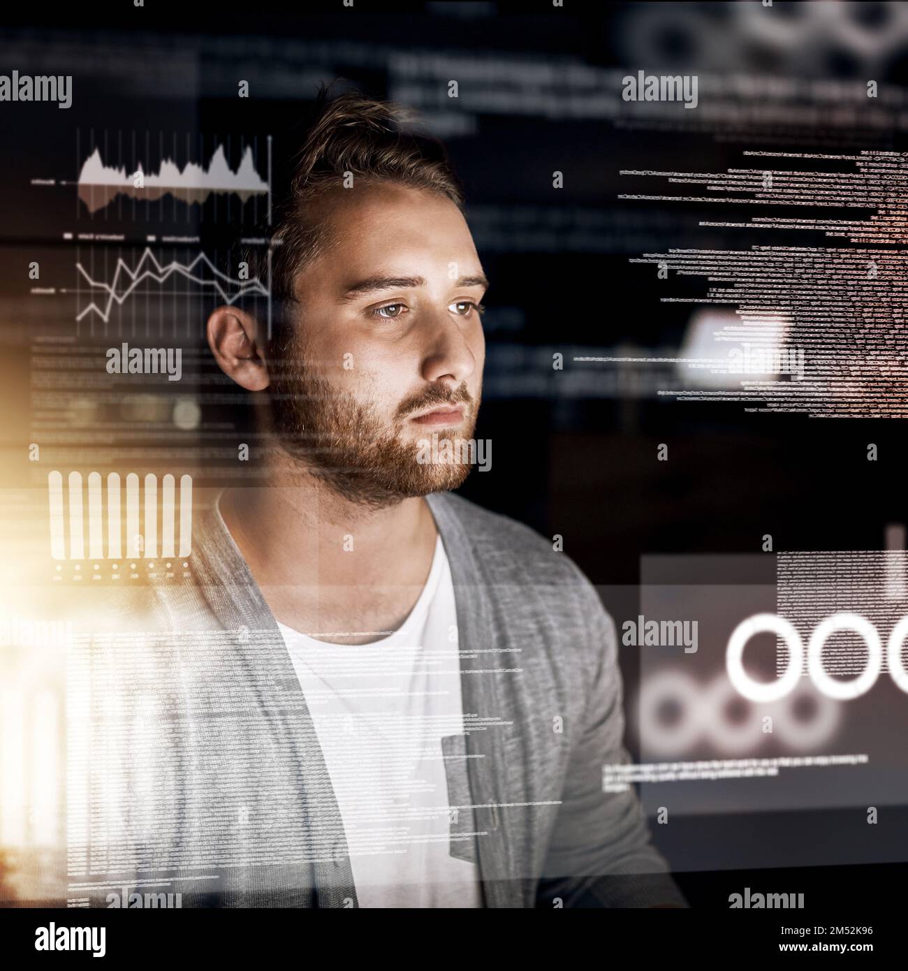 Programming the night away. a young computer programmer working on