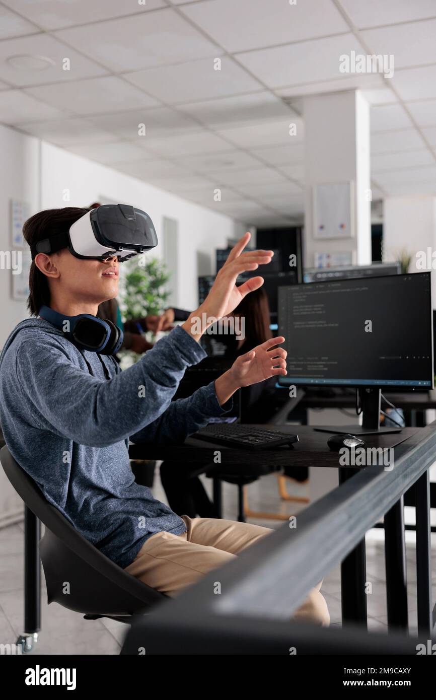 It programmer wearing virtual reality headset to code new server